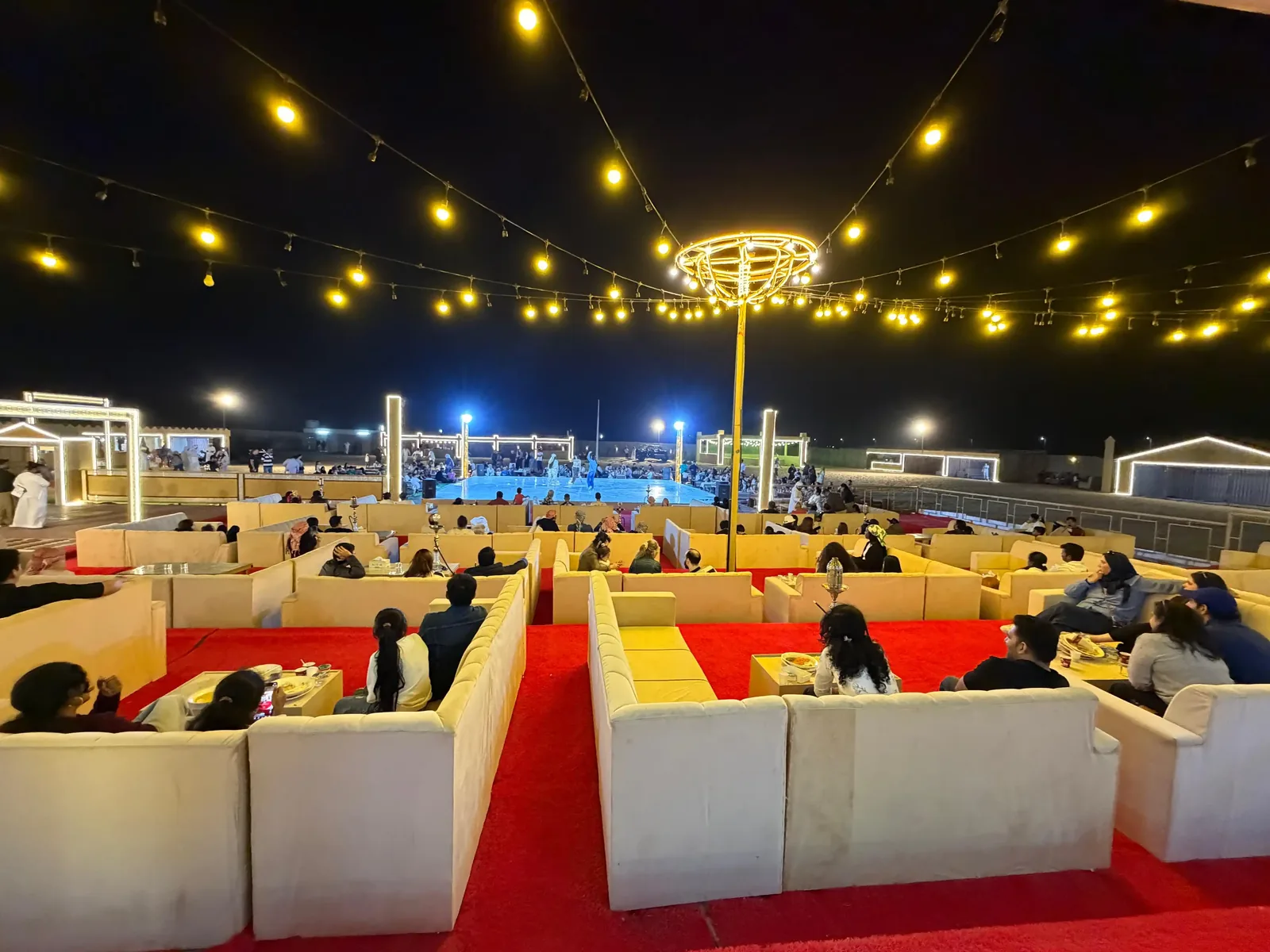 Abu Dhabi evening desert safari camp and entertainment at sunset